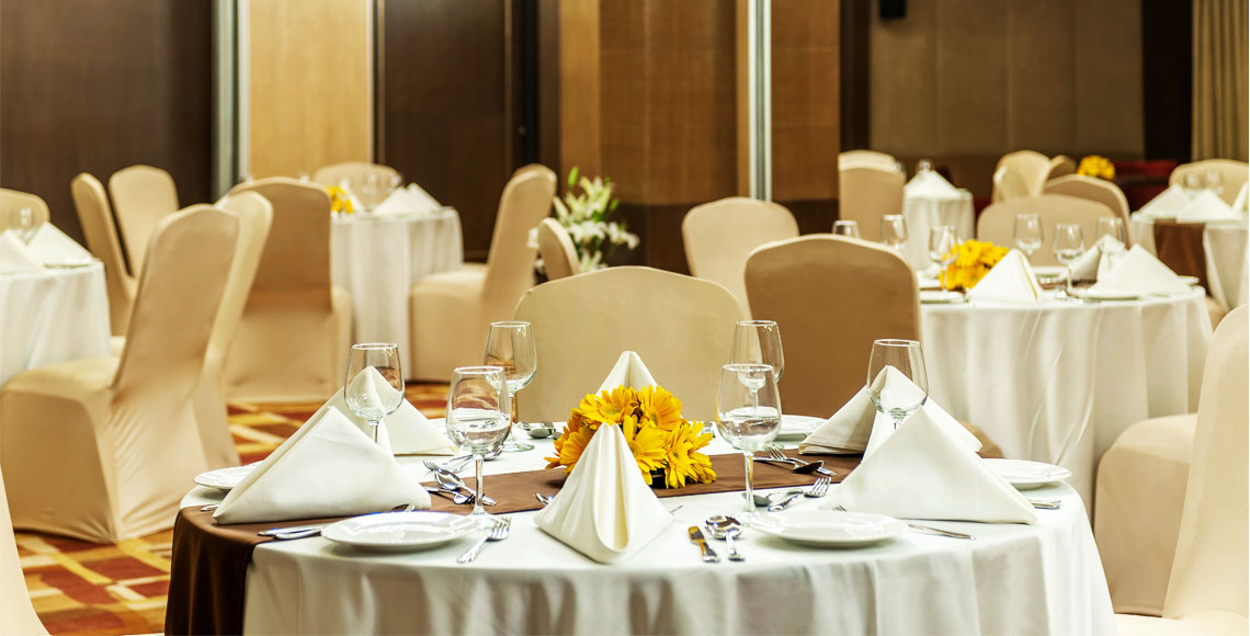 Magnificent banquet hall with crystal chandeliers and elegant table settings