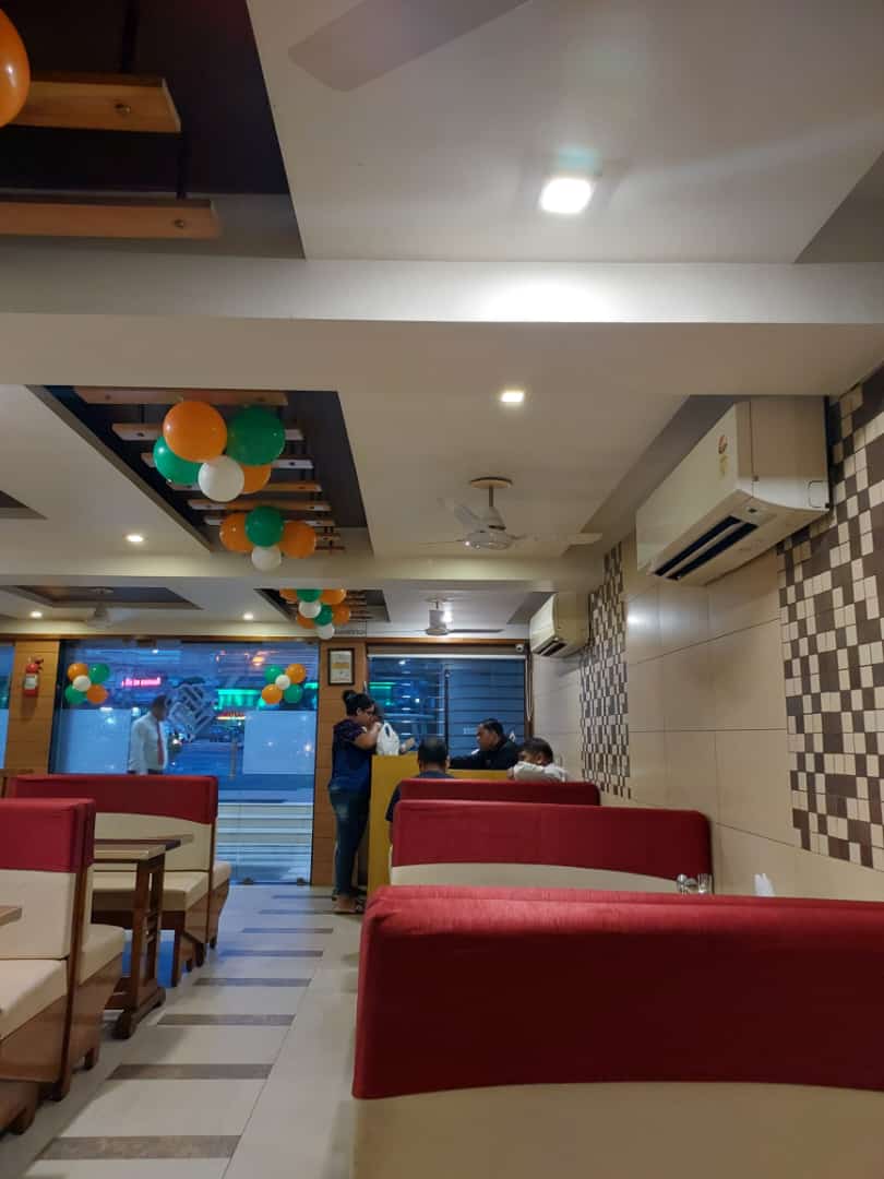 Elegant fine-dining restaurant interior at Landmark Hotel with candlelit tables and warm ambiance
